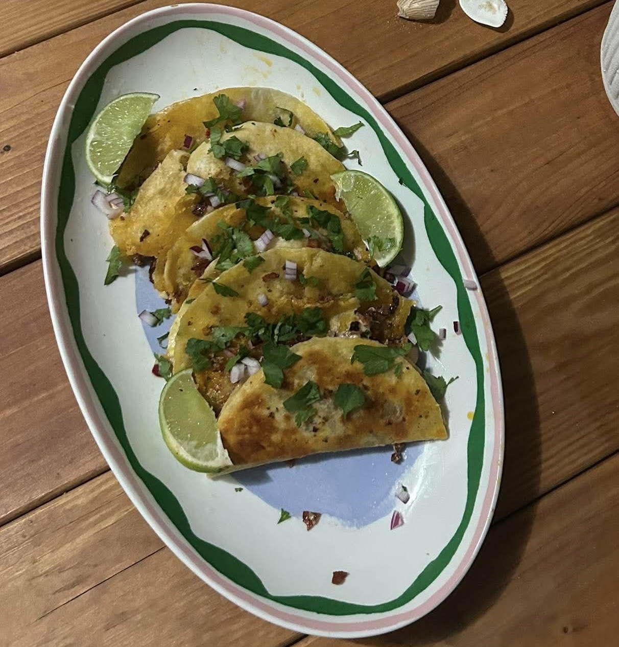 Crispy chorizo tacos with onion, coriander and lime